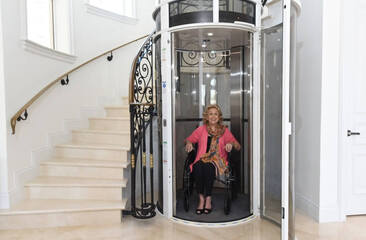 Woman in wheelchair sitting in elevator